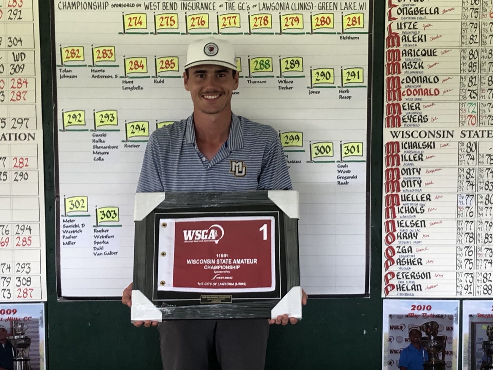 4 state am Hunter Eichhorn in front of scoreboard